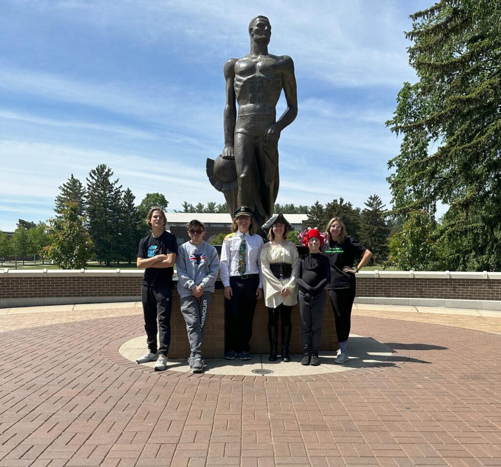 The Odyssey of the Mind team with the Spartan Statue at Michigan State University. [ Dawn Pharr | Contributed ]
